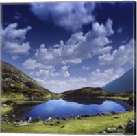 Framed Blue lake in the Pirin Mountains over tranquil clouds, Pirin National Park, Bulgaria