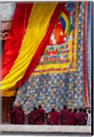 Framed Monks raising a thangka during the Hemis Festival, Ledakh, India