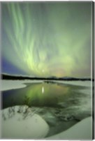 Framed Aurora Borealis over a creek, Yukon, Canada