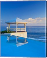 Framed Gazebo reflecting on pool with sea in background, Long Island, Bahamas