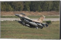 Framed F-16C Barak of the Israeli Air Force taking off from Hatzor Air Force Base