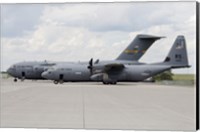 Framed C-130J Super Hercules with a C-17 Globemaster