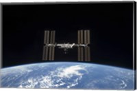 Framed International Space Station Backdropped by Earth's horizon