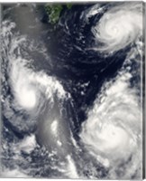 Framed Three different Typhoons Spinning over the Western Pacific Ocean