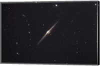 Framed NGC 4565, an edge-on unbarred spiral galaxy in the Constellation Coma Berenices