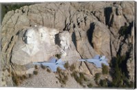 Framed Two F/A-18E Super Hornets conduct a fly by of Mount Rushmore