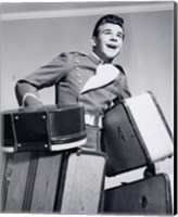 Framed 1950s Smiling Bellboy Carrying Four Bags Of Luggage