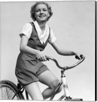 Framed 1930s Smiling Blonde Woman Riding Bicycle