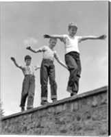 Framed 1950s Three Laughing Boys Walking On Top Of Stone Wall