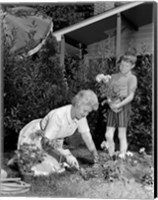 Framed 1960s Boy Helping Grandmother Plant Flowers