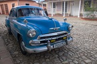 Framed Cuba, Trinidad Blue Taxi Parked On Cobblestones