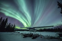 Framed Northern Lights Above a Plane at Night