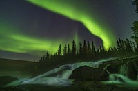 Framed Auroral Curtains Over Ramparts Falls On the Cameron River