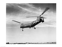 Framed Low angle view of a military helicopter in flight, H-21D Helicopter, US Military