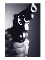 Framed Close-up of a person holding a handgun
