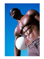 Framed Low angle view of a young man holding a volleyball