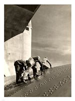 Framed Three construction workers putting a coat of paint on a slanted wall of riveted-steel plates on the Hoover Dam spillway