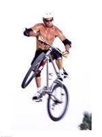 Framed Young man on a bicycle in mid-air