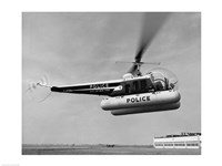 Framed Low angle view of a helicopter in flight, Bell 47-D, Bell Aircraft Corporation