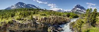 Framed Waterfalls at base of a lake, Swiftcurrent Lake, Glacier National Park, Montana, USA