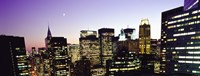 Framed Buildings lit up at dusk, Manhattan