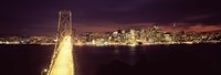 Framed Bay Bridge and San Francisco skyline at night, California