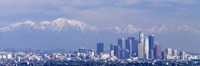 Framed Buildings in a city with snowcapped mountains in the background, San Gabriel Mountains, City of Los Angeles, California, USA