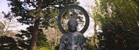 Framed Statue of Buddha in a park, Japanese Tea Garden, Golden Gate Park, San Francisco, California, USA