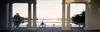 Framed Person stretching near colonnade, Lake Merritt, Oakland, Alameda County, California, USA