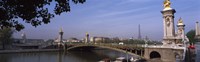 Framed Bridge across a river with the Eiffel Tower in the background, Pont Alexandre III, Seine River, Paris, Ile-de-France, France