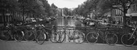 Framed Bicycle Leaning Against A Metal Railing On A Bridge, Amsterdam, Netherlands