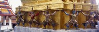 Framed Statues at base of golden chedi, The Grand Palace, Bangkok, Thailand