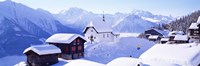 Framed Snow Covered Chapel and Chalets Swiss Alps Switzerland