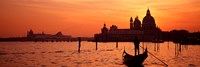 Framed Silhouette of a person on a gondola with a church in background, Santa Maria Della Salute, Grand Canal, Venice, Italy