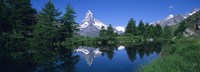 Framed Reflection of a snow covered mountain near a lake, Grindjisee, Matterhorn, Zermatt, Switzerland