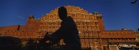 Framed Silhouette of a person riding a motorcycle in front of a palace, Hawa Mahal, Jaipur, Rajasthan, India