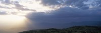 Framed Sunbeams radiating through clouds, Great Rift Valley, Kenya