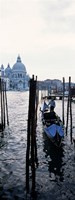 Framed Gondolier in a gondola with a cathedral in the background, Santa Maria Della Salute, Venice, Veneto, Italy