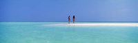Framed Two women standing on the beach sandbar, Maayafushi Island, Ari Atoll, Maldives