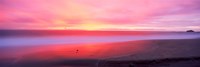 Framed Sunset light painting waves across sandy shore on beach, Laguna Beach, California, USA