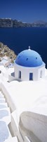 Framed High angle view of a church with blue dome, Oia, Santorini, Cyclades Islands, Greece