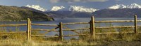 Framed Fence in front of a lake with mountains in the background, Lake General Carrera, Andes, Patagonia, Chile