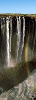 Framed Rainbow forms in the water spray in the gorge at Victoria Falls, Zimbabwe