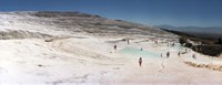 Framed Tourists enjoying the hot springs and travertine pool, Pamukkale, Denizli Province, Turkey