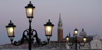 Framed Lampposts lit up at dusk with building in the background, San Giorgio Maggiore, Venice, Italy