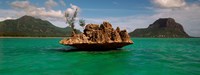 Framed Rock in Indian Ocean with mountain the background, Le Morne Mountain, Mauritius Island, Mauritius