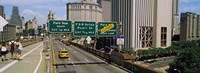 Framed Suspension bridge with buildings in a city, Brooklyn Bridge, New York City, New York State, USA