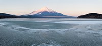 Framed Yamanaka Lake covered with ice and Mt Fuji in the background, Yamanakako, Yamanashi Prefecture, Japan