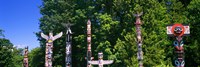 Framed Totem poles in a a park, Stanley Park, Vancouver, British Columbia, Canada