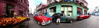 Framed 360 degree view of old cars and fruit stand on a street, Havana, Cuba